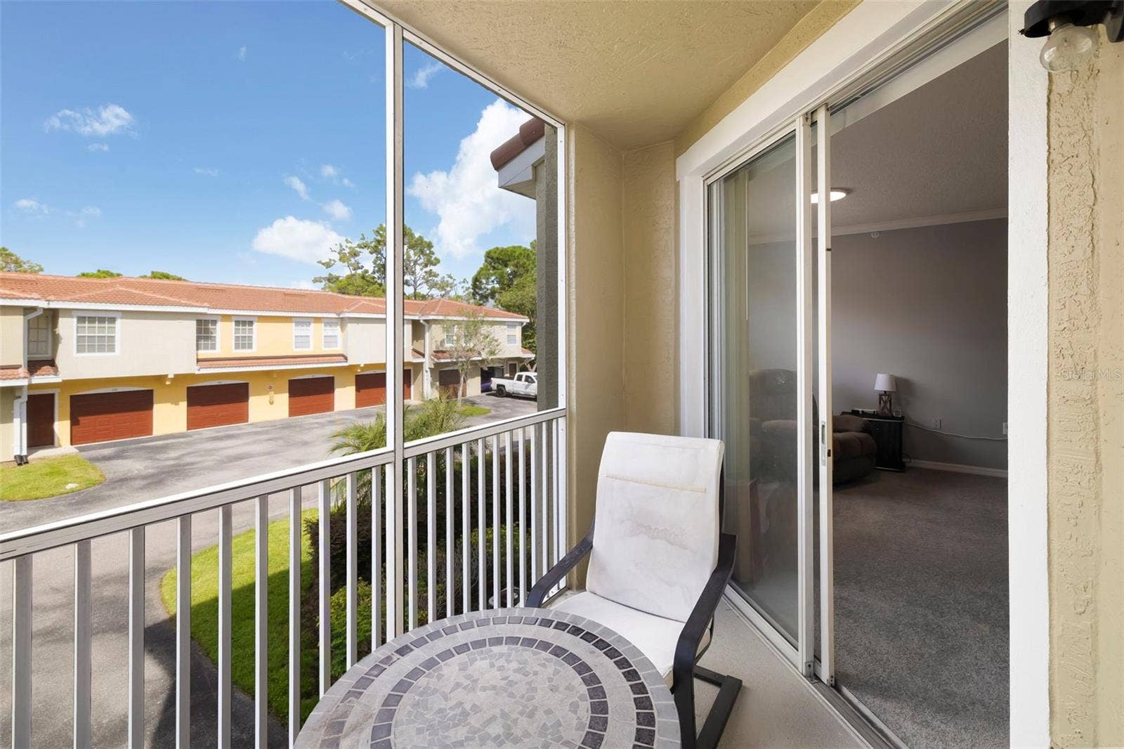 5500 BENTGRASS DRIVE, #6-203, Sarasota, FL 34235 Screened Lanai.