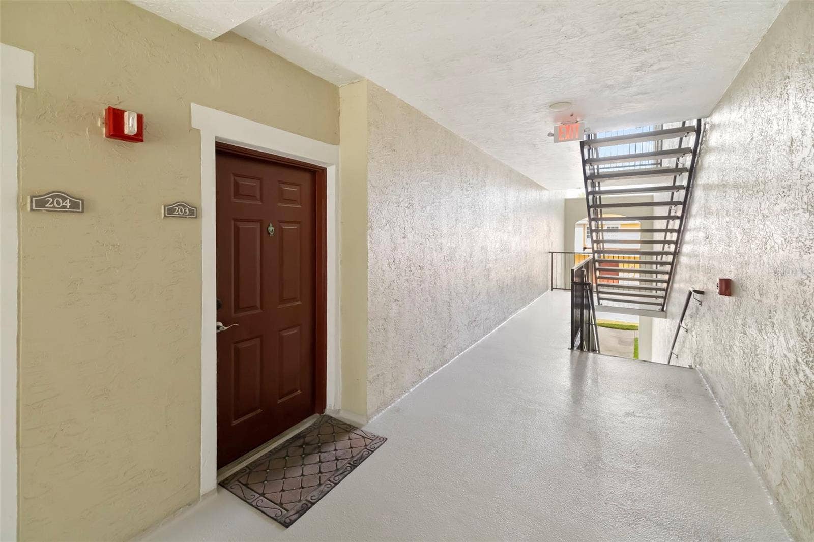 5500 BENTGRASS DRIVE, #6-203, Sarasota, FL 34235 Up Stairs to Second Floor. Unit on Right.