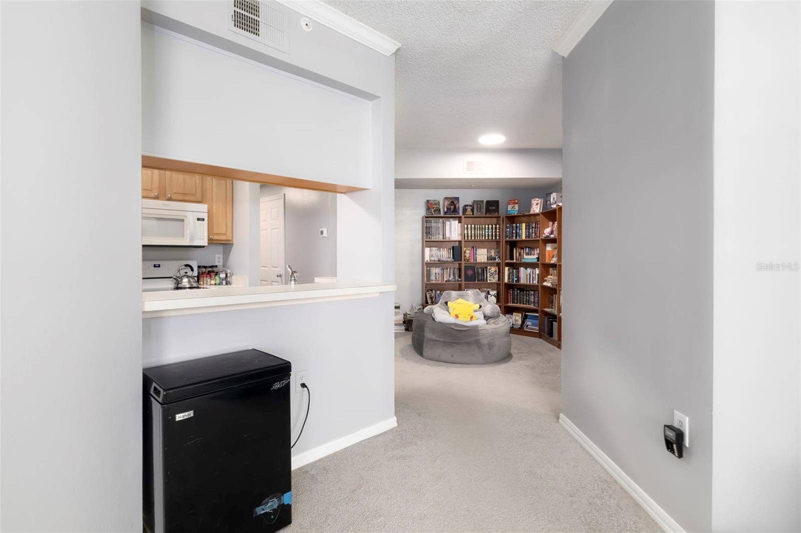 5500 BENTGRASS DRIVE, #6-203, Sarasota, FL 34235 Living Area to Kitchen.