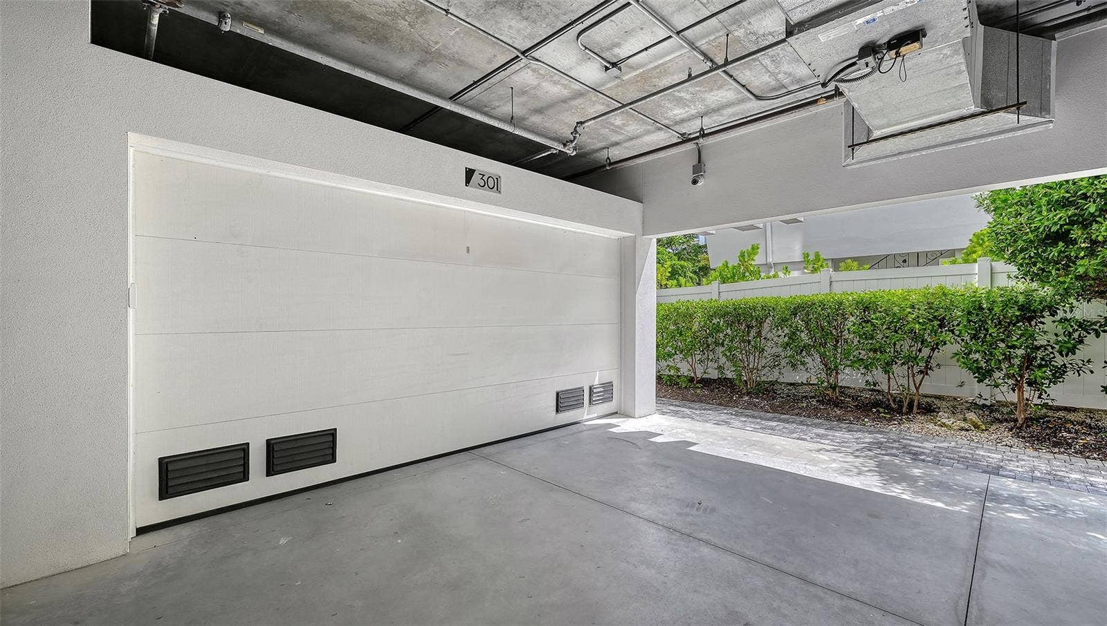 Under building 2 car garage for unit 301