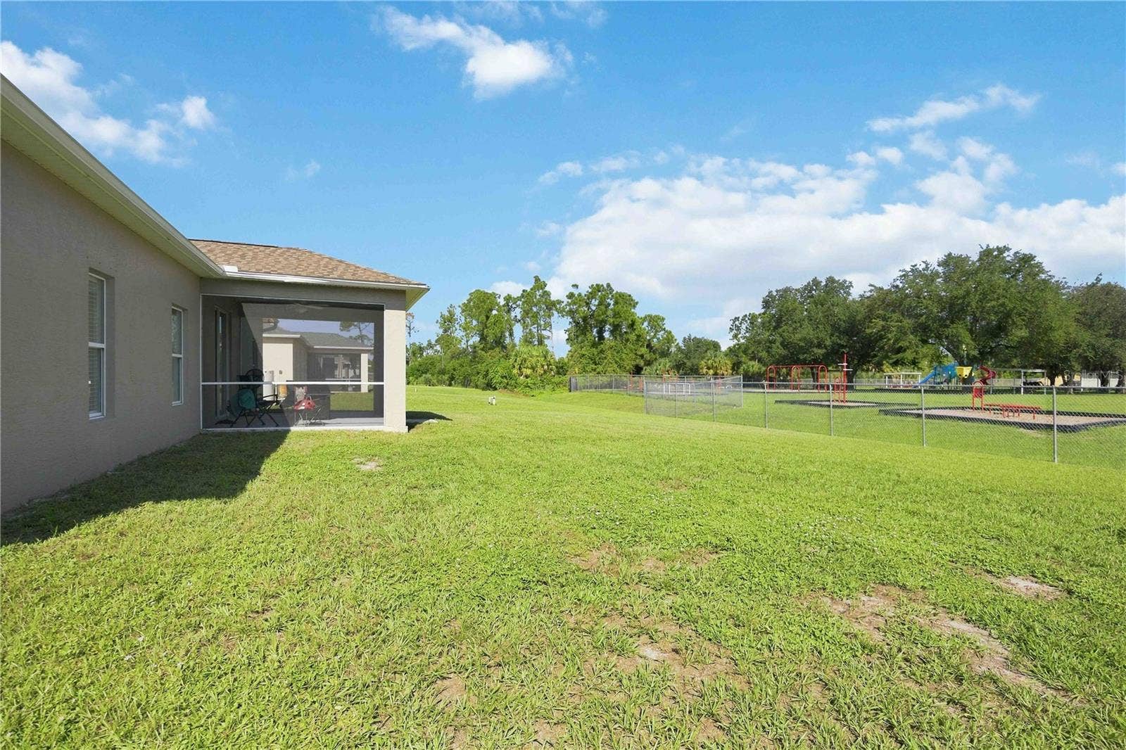 1150 KNOTTY PINE AVENUE, North Port, FL 34288 No neighbors behind you, opens up to a school.