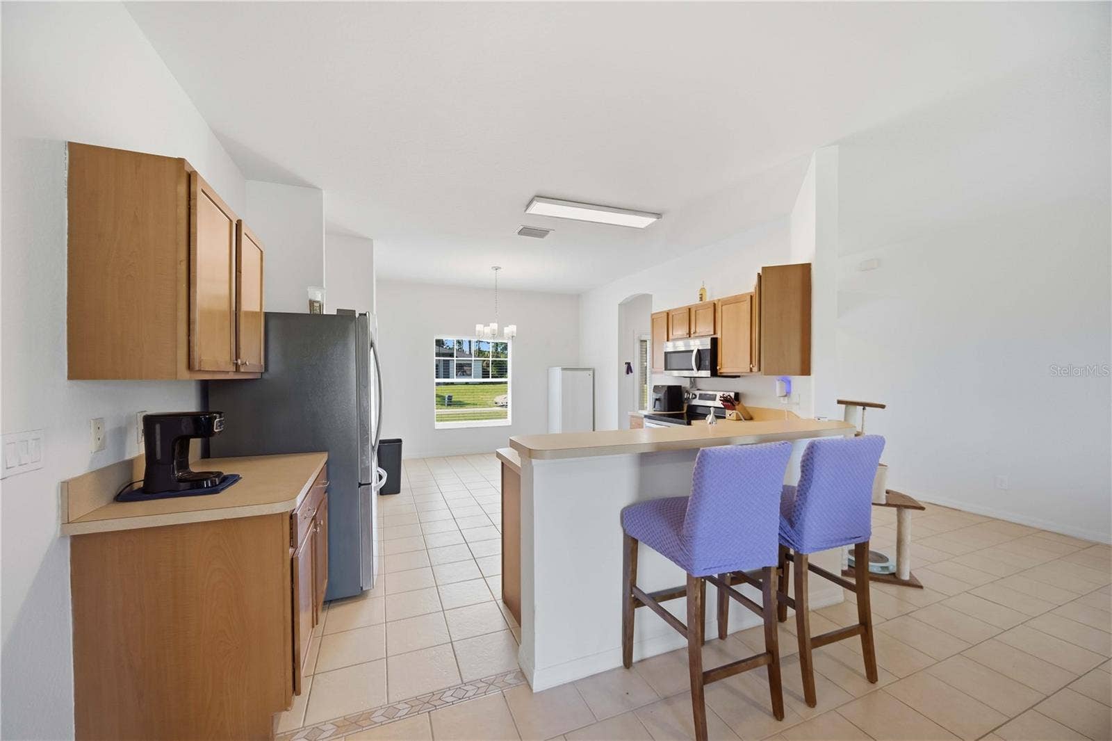 1150 KNOTTY PINE AVENUE, North Port, FL 34288 Kitchen is open to the living room