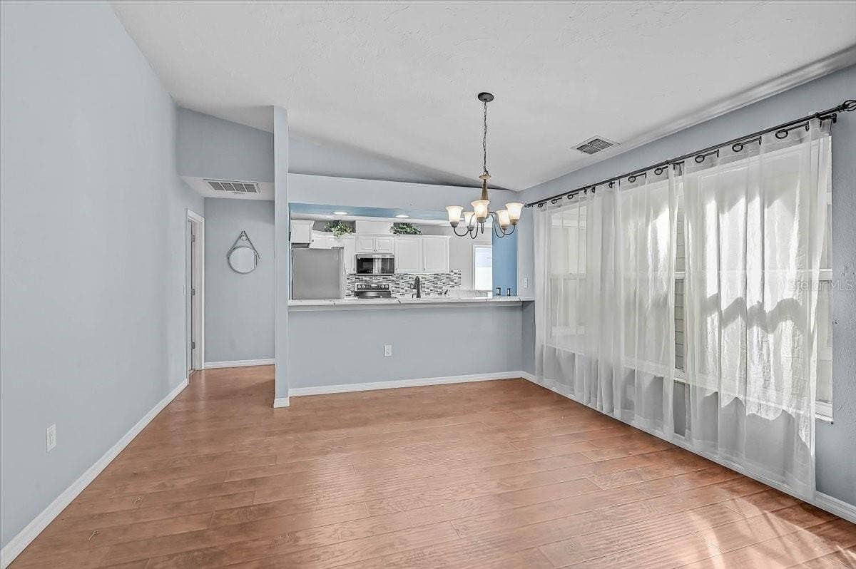 7739 33RD LANE E, Sarasota, FL 34243 Dining Room and Kitchen
