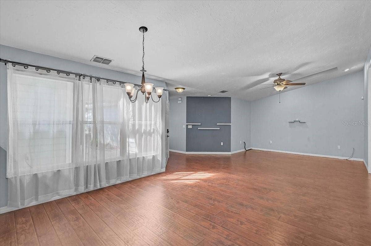 7739 33RD LANE E, Sarasota, FL 34243 Dining Room Looking into Living Room