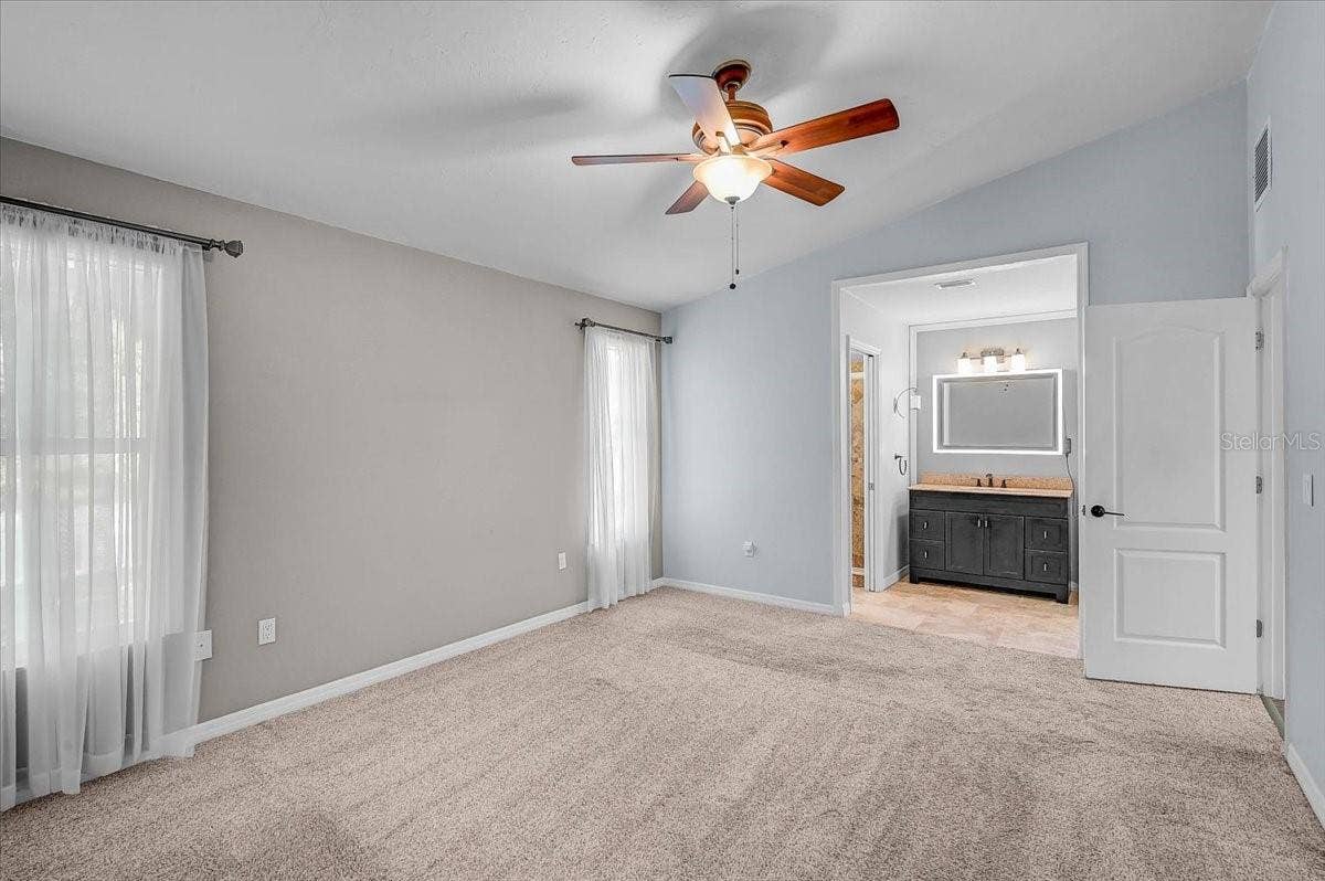7739 33RD LANE E, Sarasota, FL 34243 Primary Bedroom and Ensuite Bath