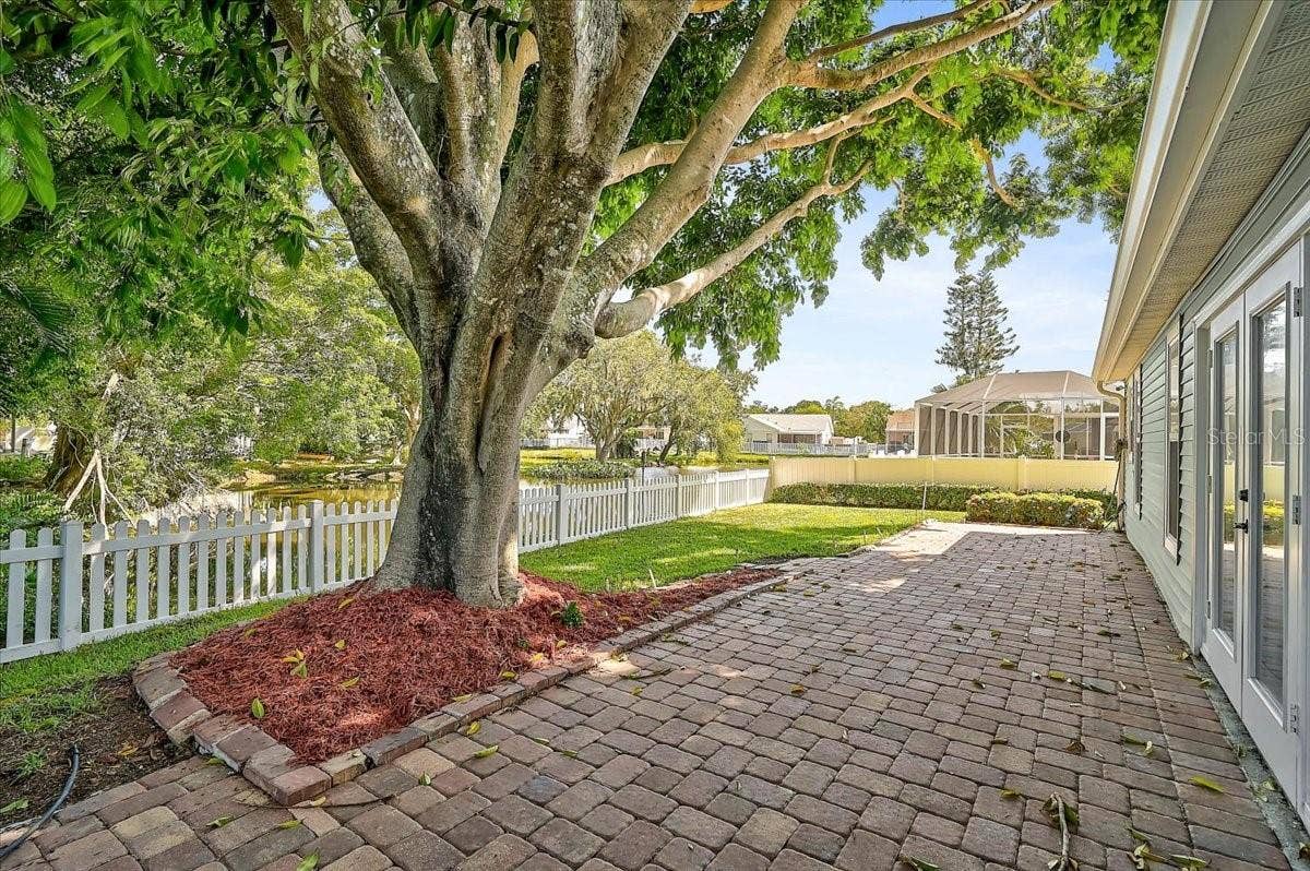 7739 33RD LANE E, Sarasota, FL 34243 Rear Patio 44' x 10' at Pond