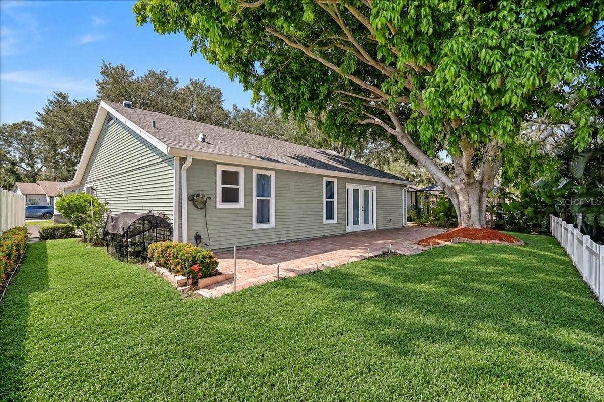 7739 33RD LANE E, Sarasota, FL 34243 Rear Patio 44' x 10' at Pond