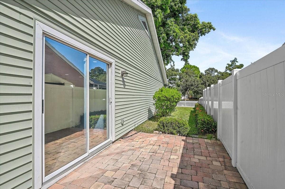 7739 33RD LANE E, Sarasota, FL 34243 Side Patio 35' x 9' Off Dinette