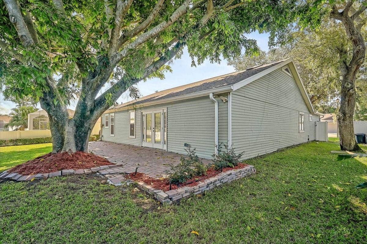 7739 33RD LANE E, Sarasota, FL 34243 Rear Patio 44' x 10' at Pond