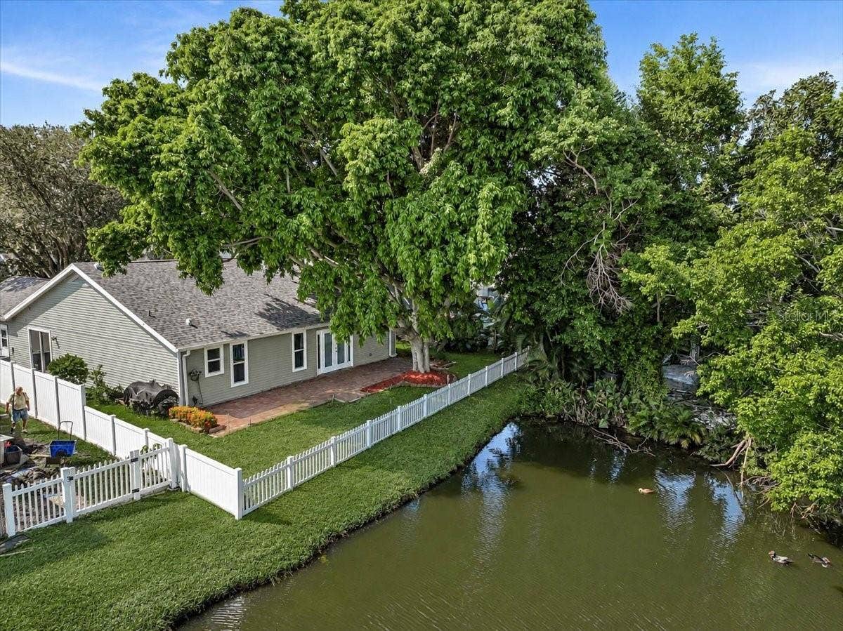 7739 33RD LANE E, Sarasota, FL 34243 Back of Home at Pond