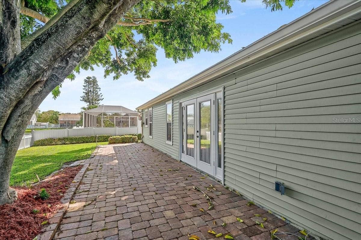 7739 33RD LANE E, Sarasota, FL 34243 Rear Patio 44' x 10' at Pond