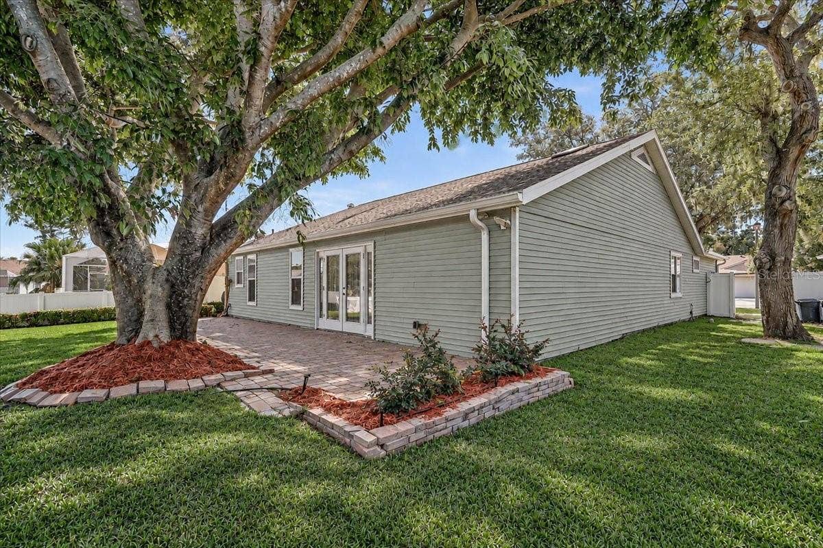 7739 33RD LANE E, Sarasota, FL 34243 Rear Patio 44' x 10' at Pond
