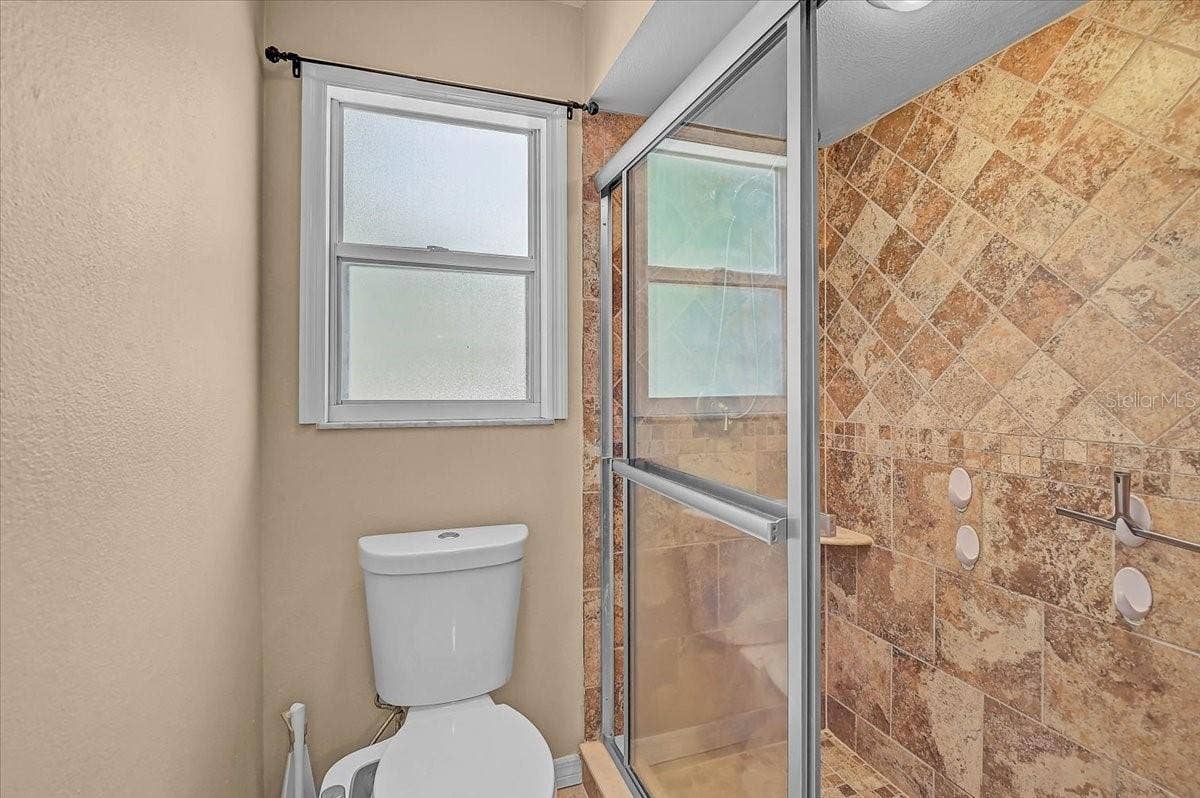 7739 33RD LANE E, Sarasota, FL 34243 Primary Bathroom and Shower