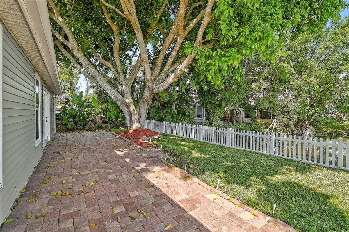 7739 33RD LANE E, Sarasota, FL 34243 Rear Patio 44' x 10' at Pond