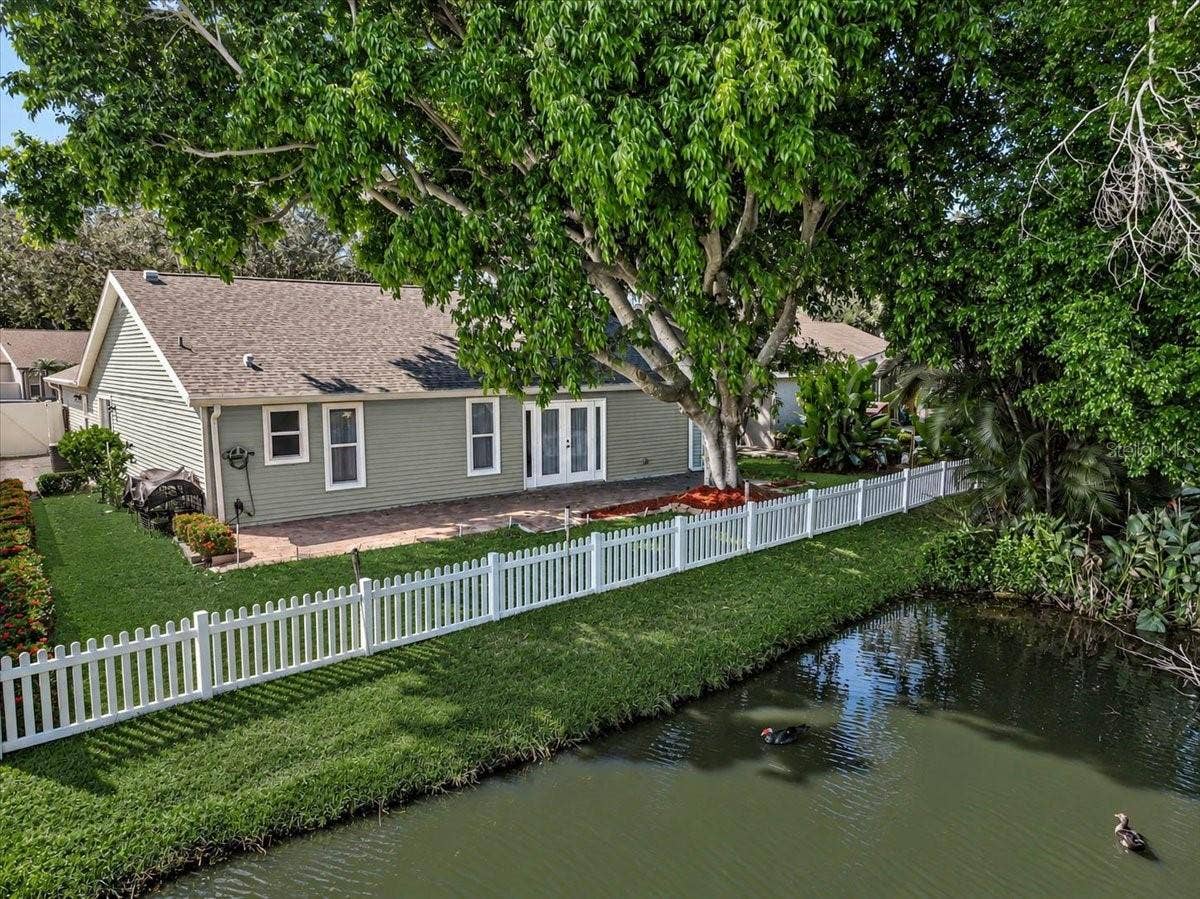 7739 33RD LANE E, Sarasota, FL 34243 Rear Patio 44' x 10' at Pond