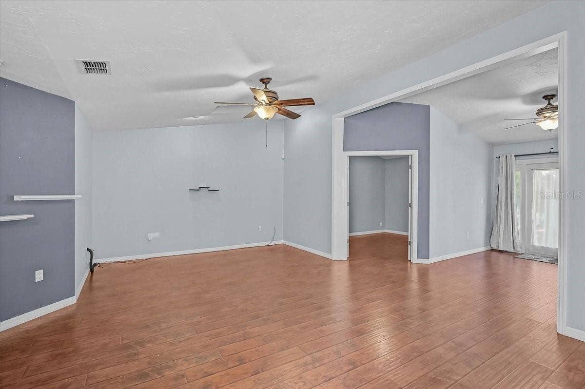 7739 33RD LANE E, Sarasota, FL 34243 Living Room, Den with Double French Doors, Open Bonus Room to Exterior French Doors to Back Patio and Pond.