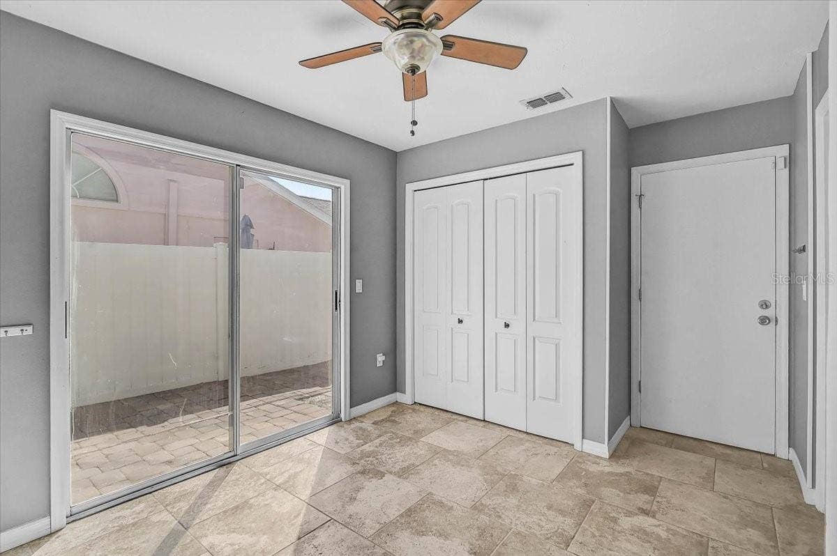 7739 33RD LANE E, Sarasota, FL 34243 Dinette and Pantry to Garage Door and Sliding Door to Side Patio 35' x 9'