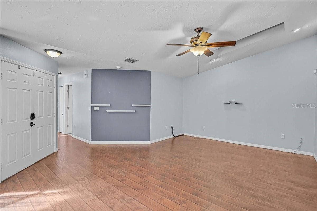 7739 33RD LANE E, Sarasota, FL 34243 Living Room and Double Front Door