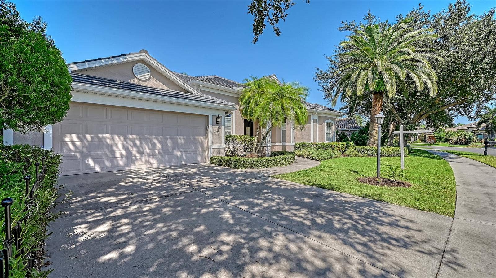 335 PARK TRACE BOULEVARD, Osprey, FL 34229 Shade tree next to drive