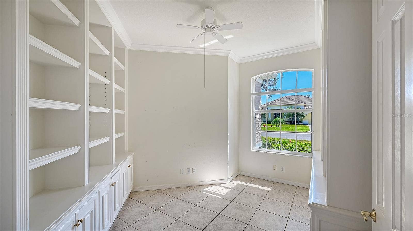 335 PARK TRACE BOULEVARD, Osprey, FL 34229 Den with custom Book Cabinets & Shelving