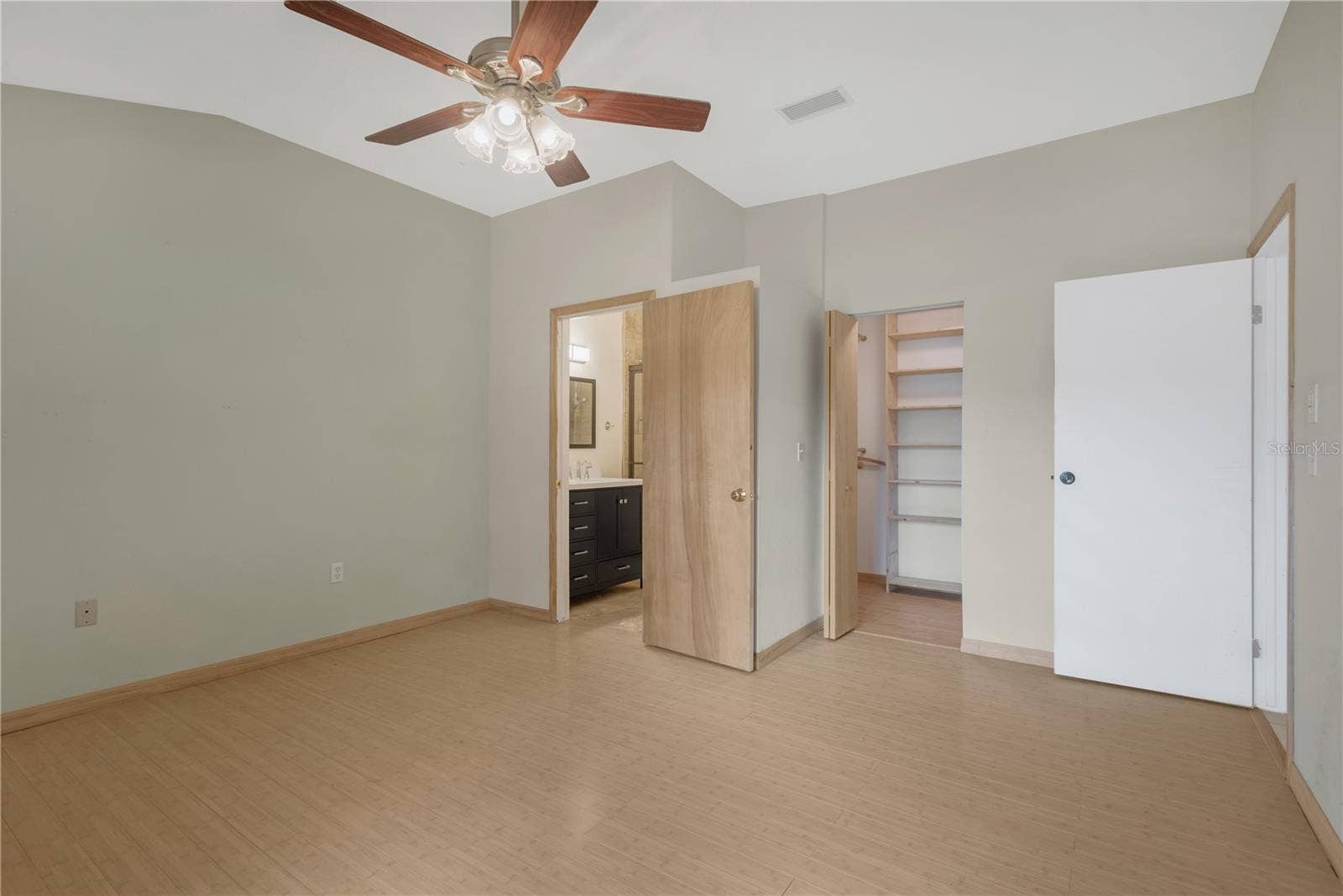 5546 34TH COURT E, Bradenton, FL 34203 Primary Bedroom has Walk-in closet with Built-ins and an En-Suite Bathroom