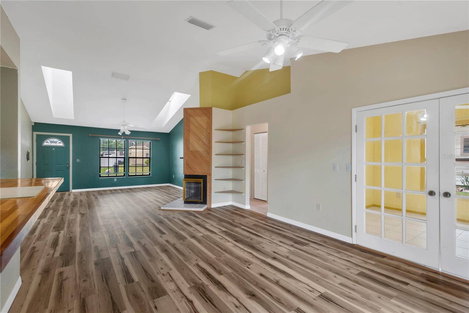 5546 34TH COURT E, Bradenton, FL 34203 Living Room, Dining Room and French Doors leading into Office (could be used as a 3rd Bedroom when company comes)