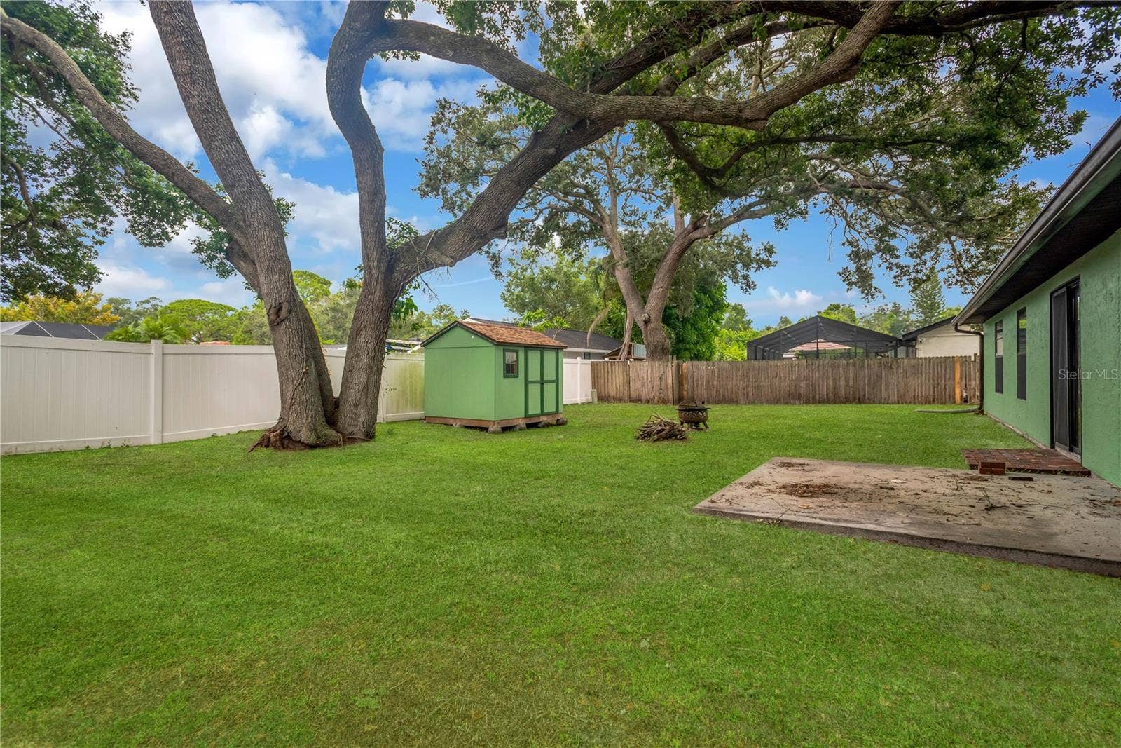 5546 34TH COURT E, Bradenton, FL 34203 Brick paver Patio just outside sliding glass doors with concrete pad for patio furniture.