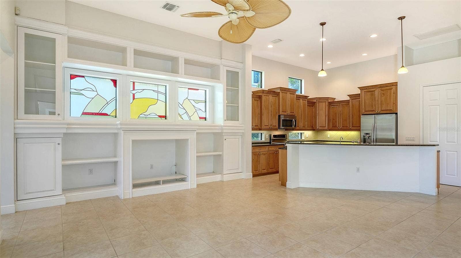 13978 SIENA LOOP, Lakewood Ranch, FL 34202 Tons of natural light in the great room and kitchen with transom windows and high soaring ceilings