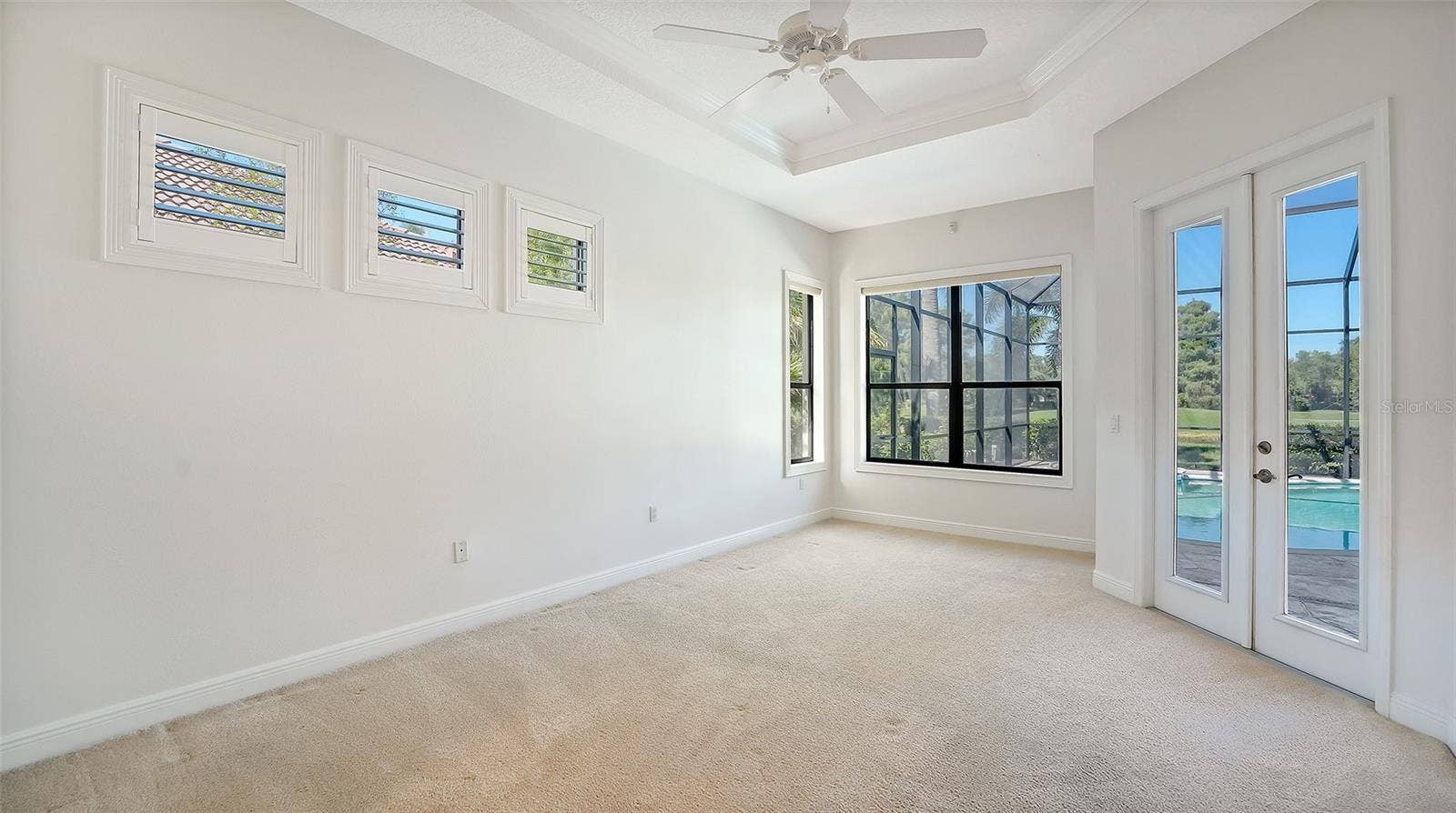 13978 SIENA LOOP, Lakewood Ranch, FL 34202 Master bedroom with lots of natural light and double french door to the lanai