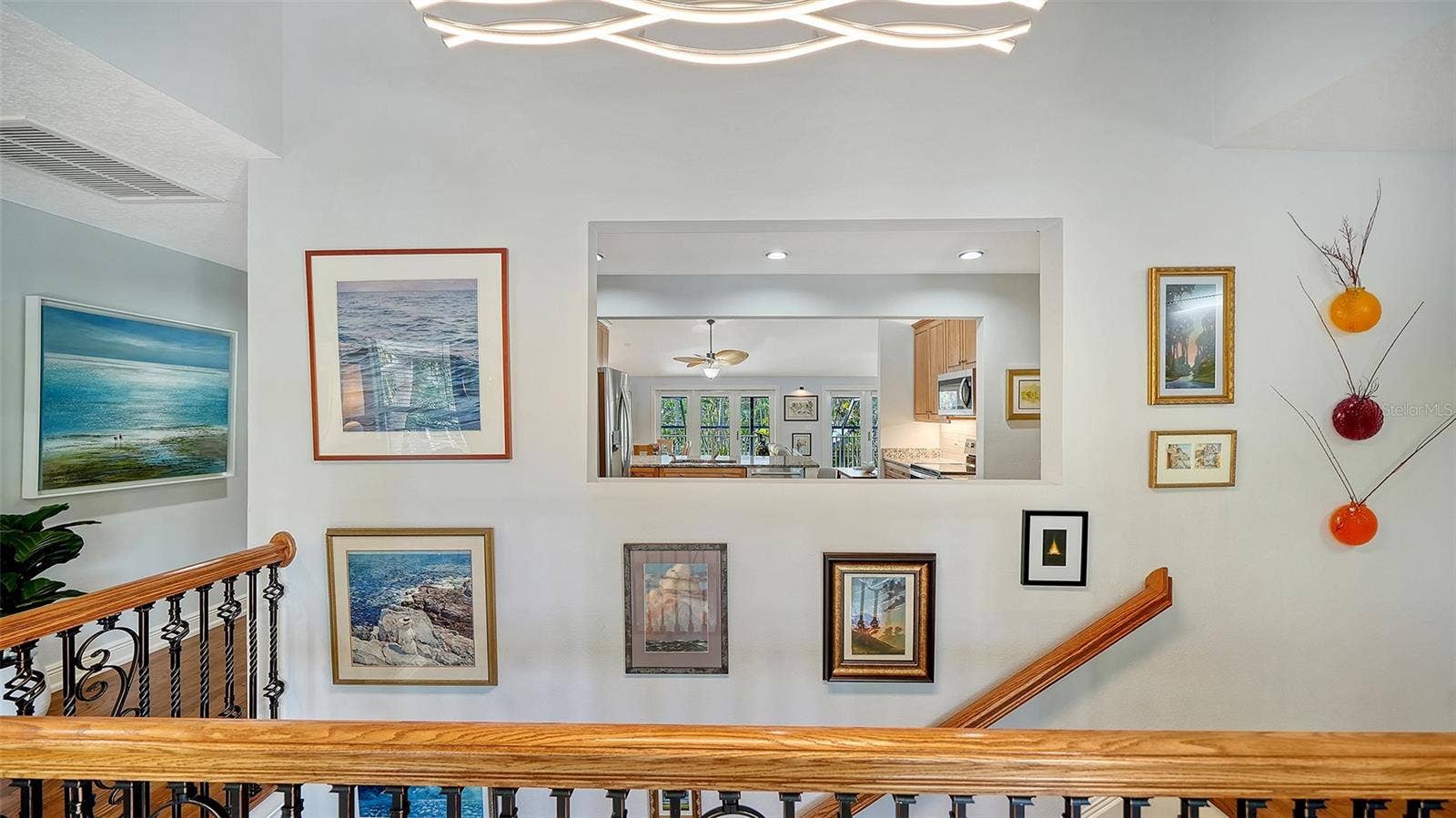 Upper hallway and staircase connecting the homes two living levels.