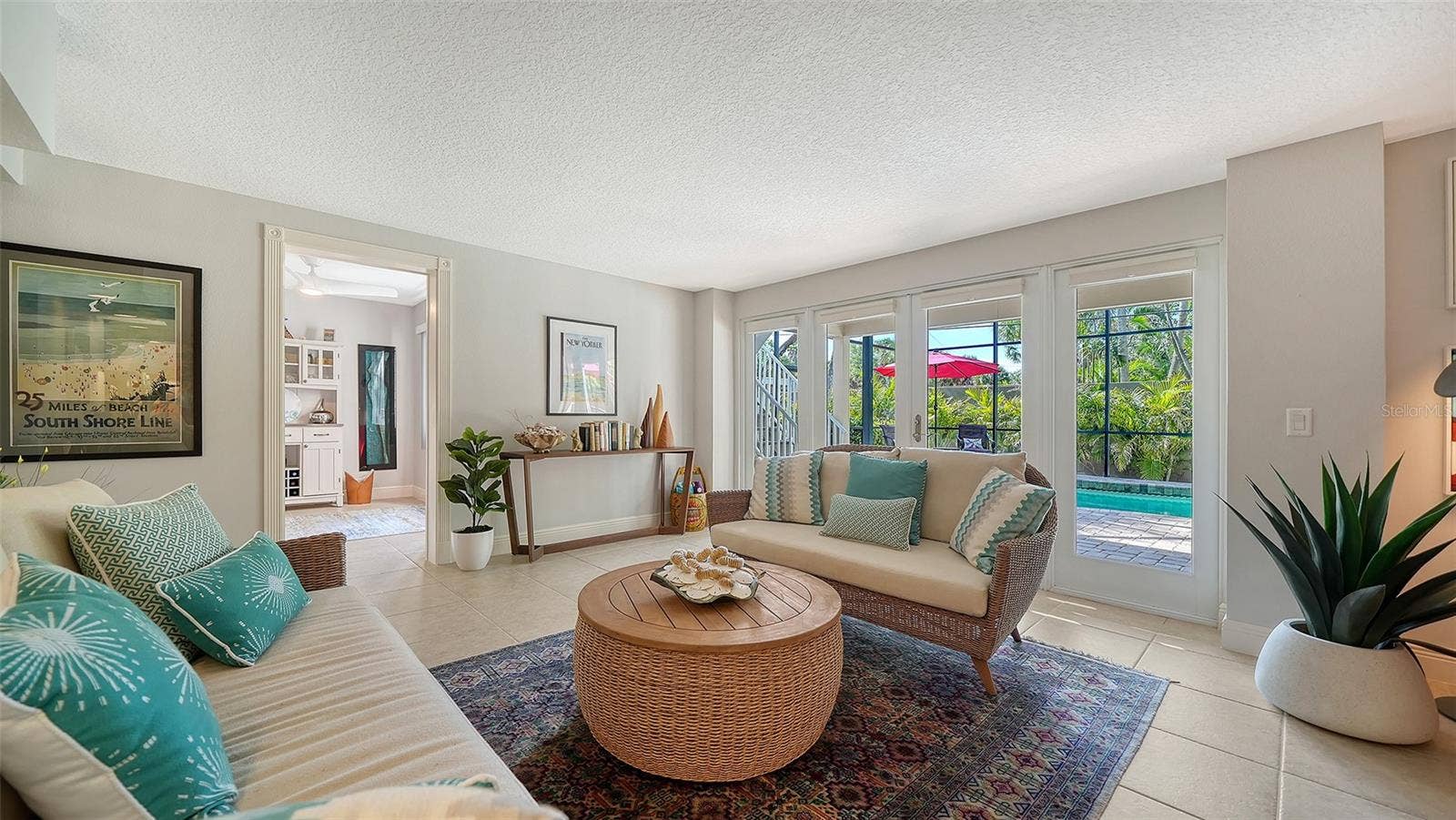 Spacious lower-level family room with French doors leading directly outside.