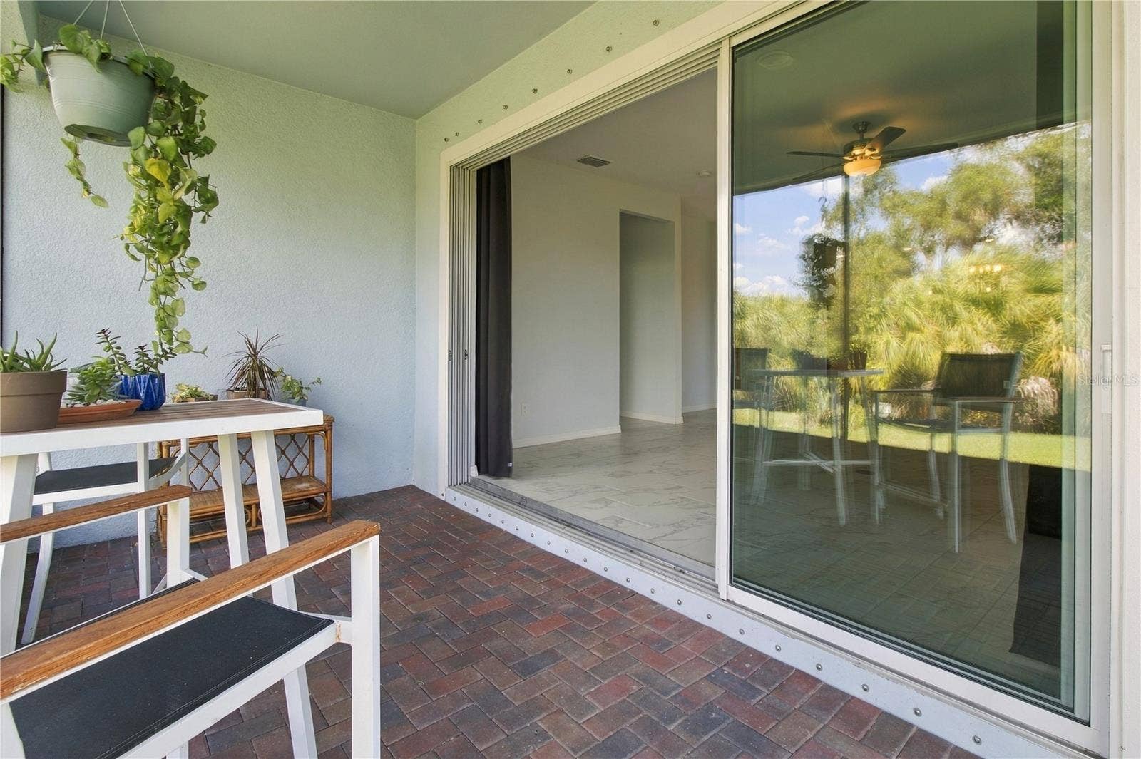 5706 MEZZANA RUN, Palmetto, FL 34221 Triple Slider to Pavered Lanai