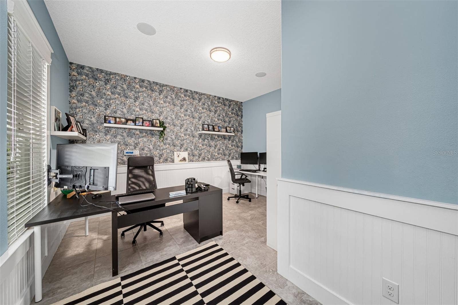 Multi-functional space ideal for a home office, study, or bonus room.