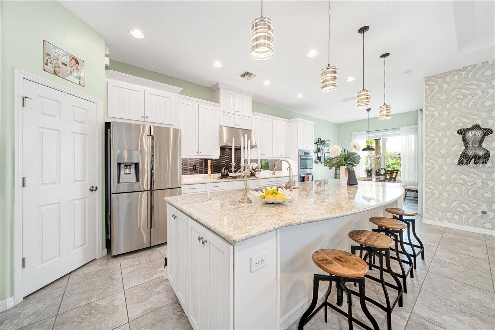 A chef-inspired kitchen with a gas range and custom finishes ideal for cooking and entertaining.