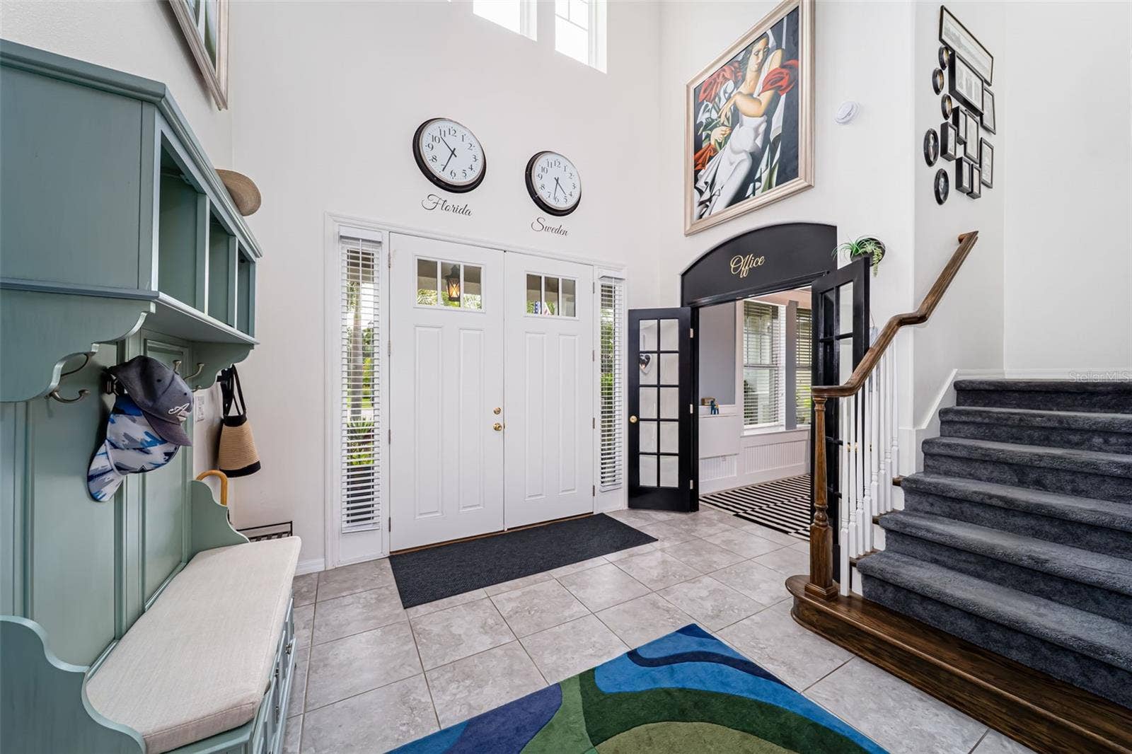 Bright and inviting foyer with impressive high ceilings