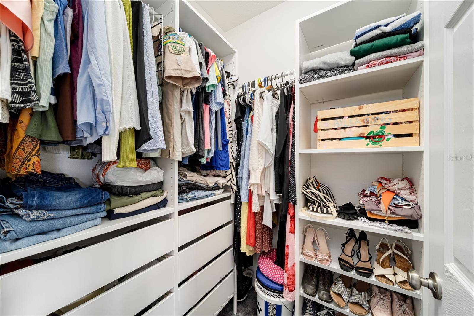 Large walk-in closet with plenty of storage.