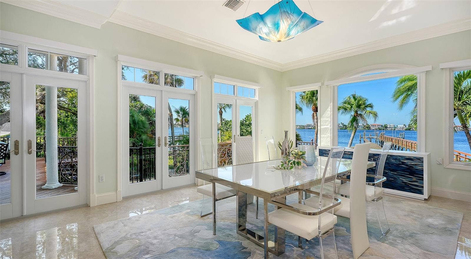 2115 LYCHEE LANE, Nokomis, FL 34275 easy access to side catwalk that connects to 1st floor primary and covered outdoor living space with fireplace and outdoor kitichen