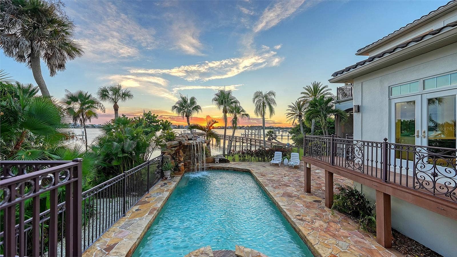 2115 LYCHEE LANE, Nokomis, FL 34275 Easy access from kitchen/dining room/ outdoor living space/ first floor primary bedroom to the pool area