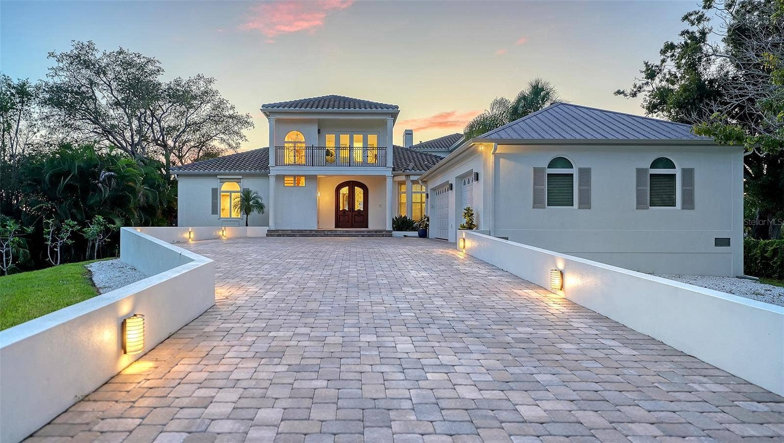 2115 LYCHEE LANE, Nokomis, FL 34275 Lighted driveway at dusk