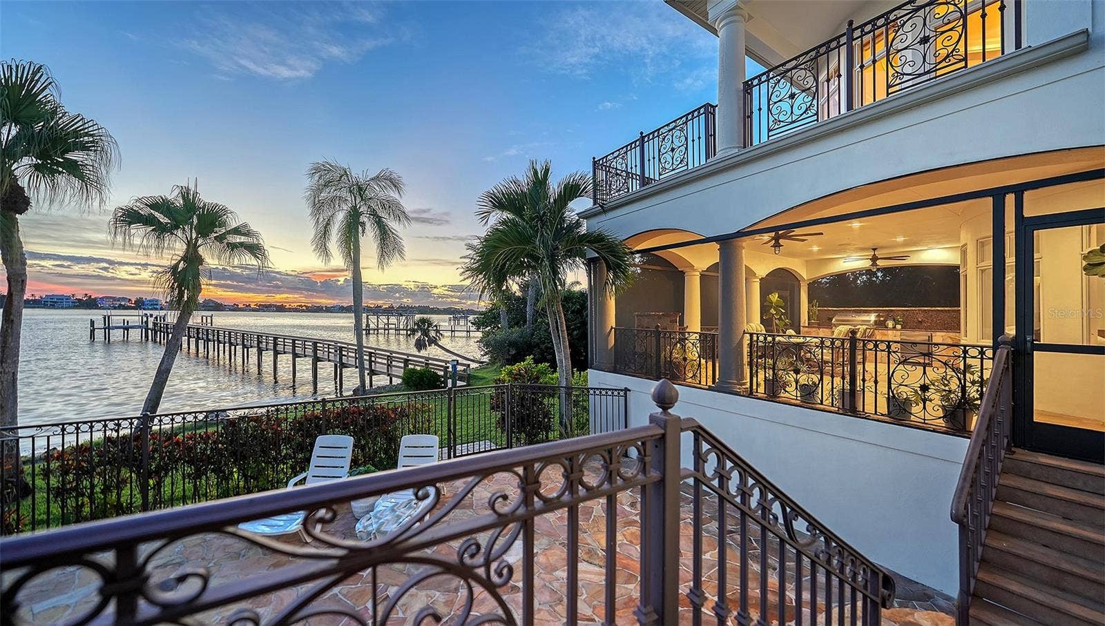 2115 LYCHEE LANE, Nokomis, FL 34275 Looking at the outdoor covered living space in the evening