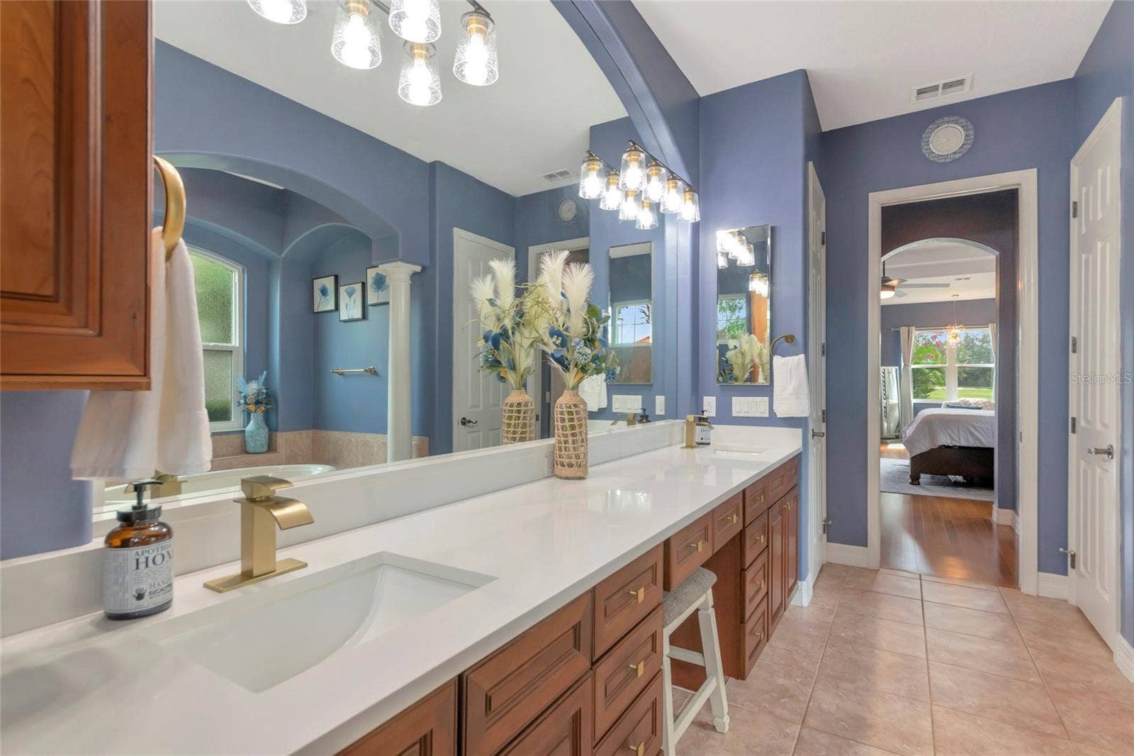 817 MARITIME COURT, Bradenton, FL 34212 Primary bathroom wood cabinets, large shower and garden tub, light and bright with plenty of natural lighting