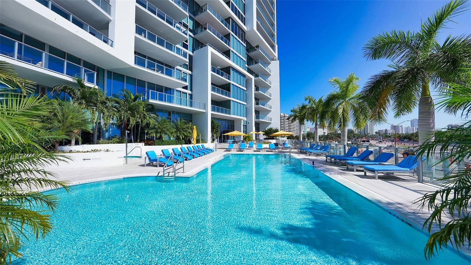 1155 N GULFSTREAM AVENUE, #207, Sarasota, FL 34236 Enjoy the luxury of a large, heated saltwater pool reserved exclusively for residents, perfect for year-round relaxation and recreation.
