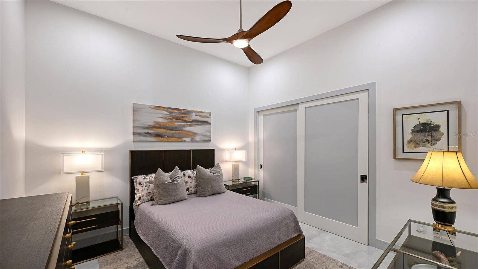 1155 N GULFSTREAM AVENUE, #207, Sarasota, FL 34236 A generous second bedroom featuring custom-designed closets and refined comfort.