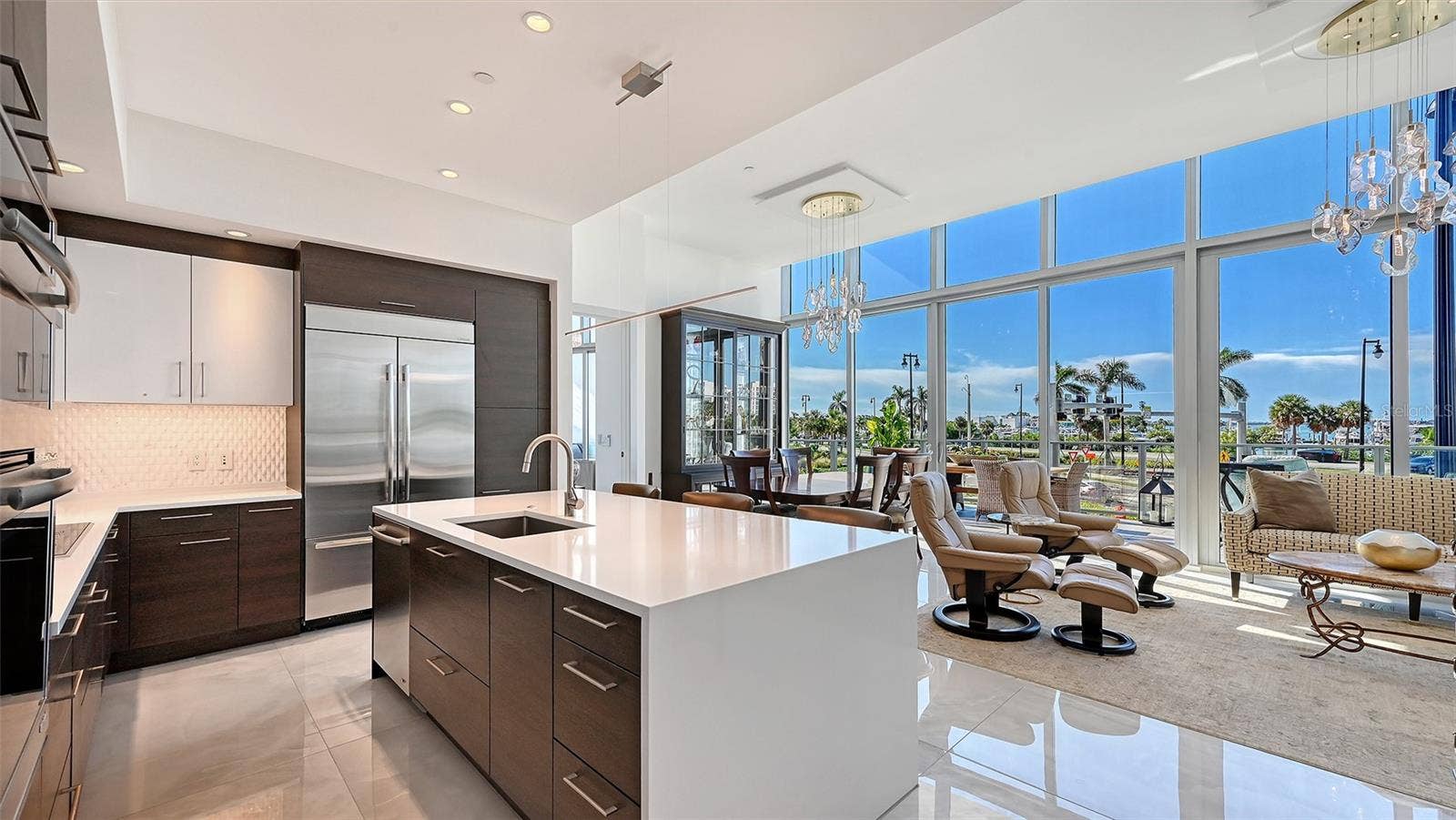 1155 N GULFSTREAM AVENUE, #207, Sarasota, FL 34236 The heart of the kitchen, offering an inviting space for guests to gather while you entertain.