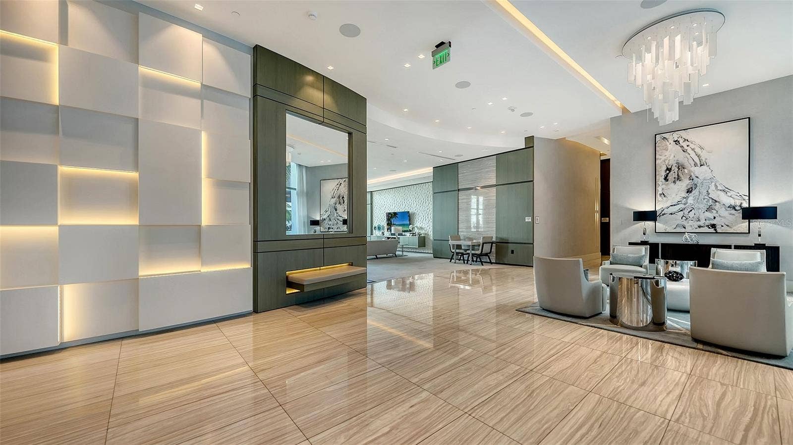 1155 N GULFSTREAM AVENUE, #207, Sarasota, FL 34236 A grand, elegant entrance featuring refined seating areas, creating a warm and sophisticated welcome for residents and their guests.