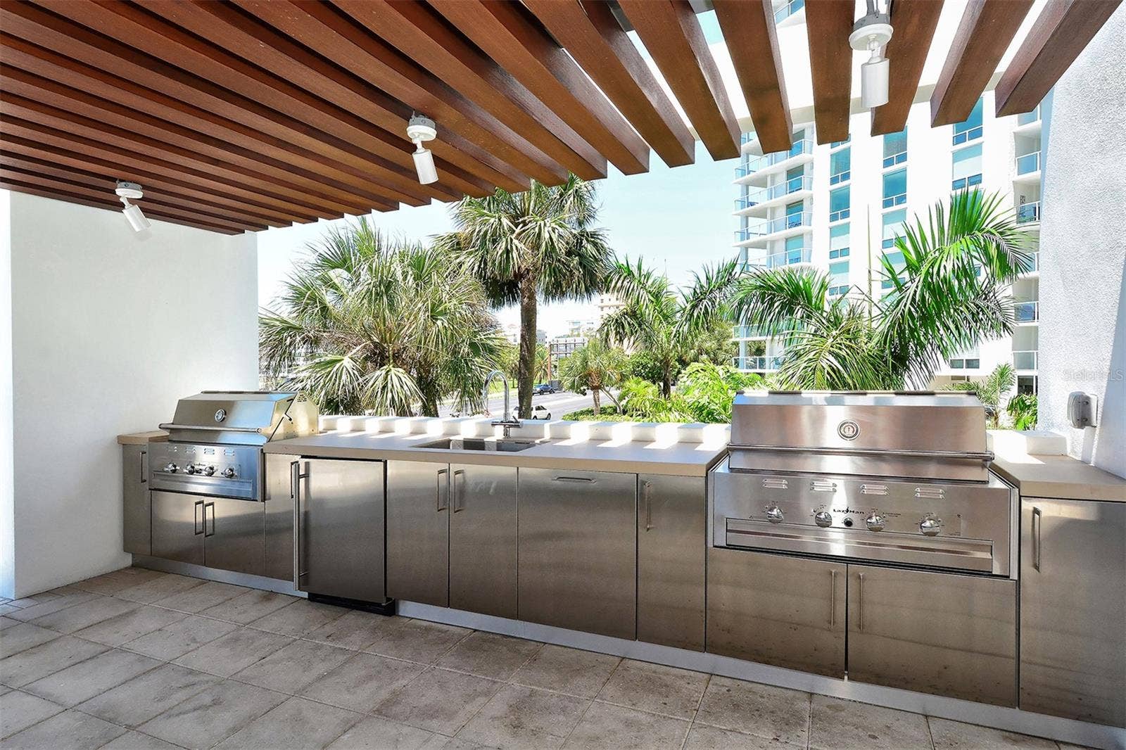 1155 N GULFSTREAM AVENUE, #207, Sarasota, FL 34236 Featuring two stainless steel grills, the resident outdoor kitchen invites you to unleash your inner chef and entertain in style.