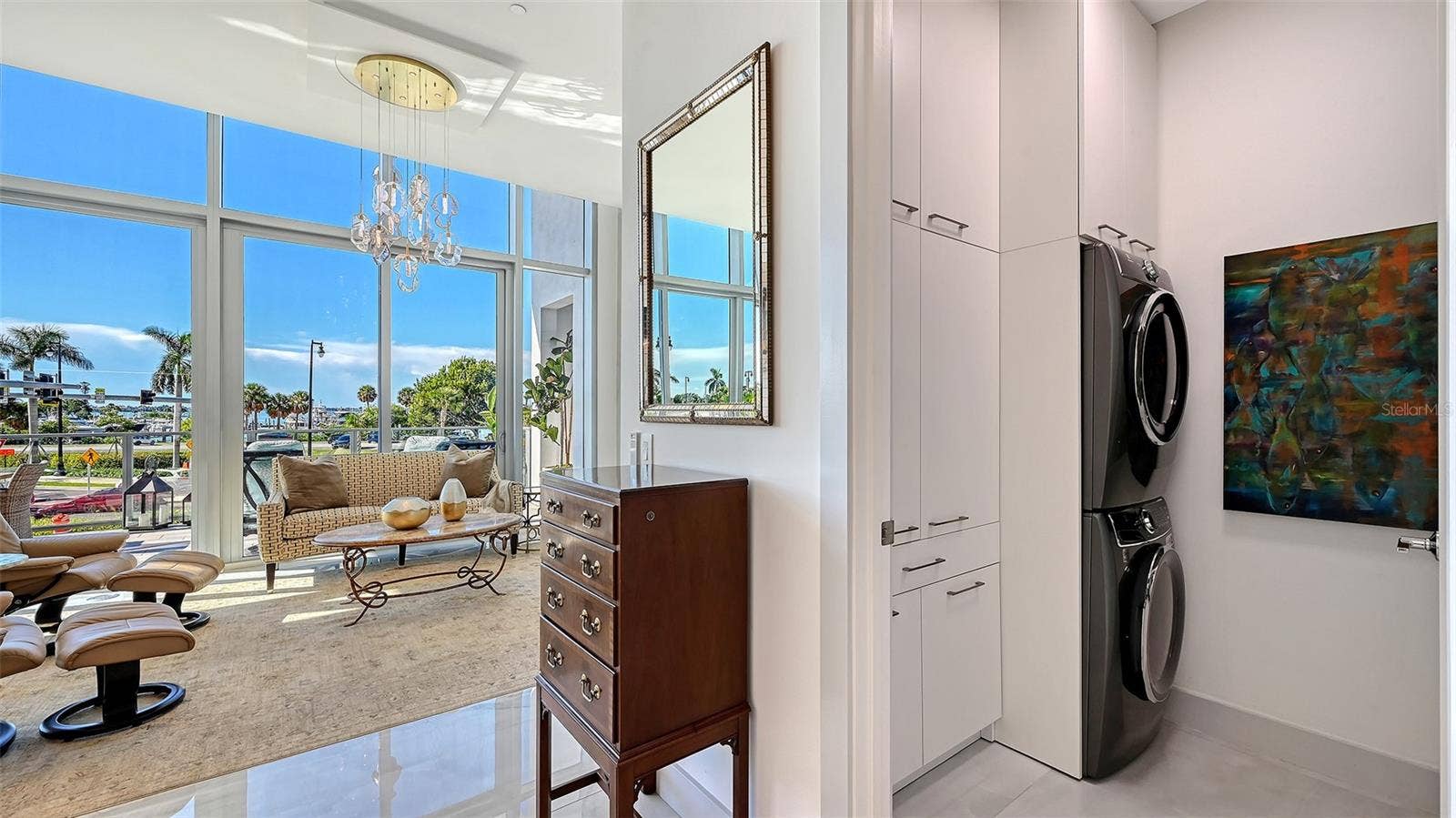 1155 N GULFSTREAM AVENUE, #207, Sarasota, FL 34236 Custom-designed laundry room featuring a new, full-size LG WashTower and custom cabinetry for exceptional storage and organization.
