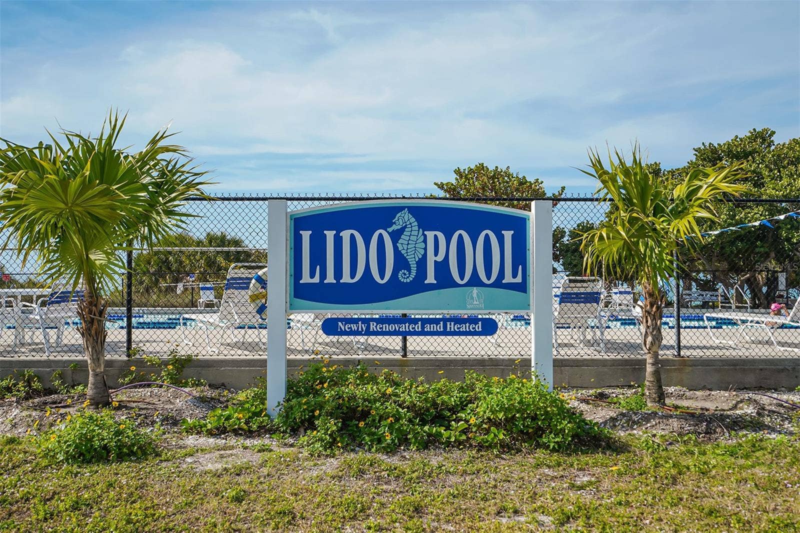 1155 N GULFSTREAM AVENUE, #207, Sarasota, FL 34236 Lido Pool at Lido Beach offers a refreshing coastal escape, surrounded by swaying palms and the beautiful white sands.