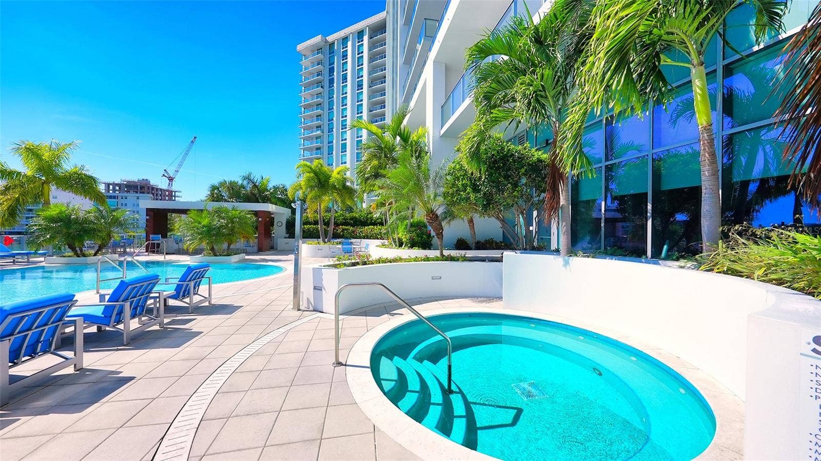 1155 N GULFSTREAM AVENUE, #207, Sarasota, FL 34236 Unwind in the poolside spa, the perfect retreat for relaxation and rejuvenation.