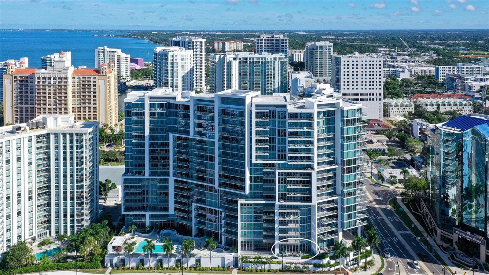 1155 N GULFSTREAM AVENUE, #207, Sarasota, FL 34236 One of only four oversized private waterfront balconies at The VUE, offering an exceptional setting for outdoor living and breathtaking bay views.